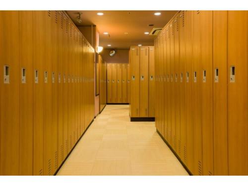 a row of wooden lockers in a locker room at Hotel Taisei Annex - Vacation STAY 05186v in Kagoshima