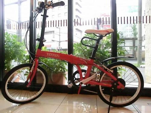 a red bike parked in front of a window at Hotel Taisei Annex - Vacation STAY 05186v in Kagoshima