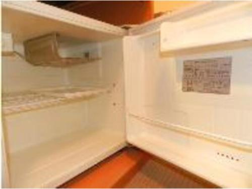 an empty refrigerator with its door open with a sign on it at Hotel Taisei Annex - Vacation STAY 04735v in Kagoshima