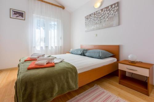 Postel nebo postele na pokoji v ubytování Apartments Robic