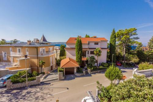 arial view of a street in a town with houses at Rooms CICO in Crikvenica