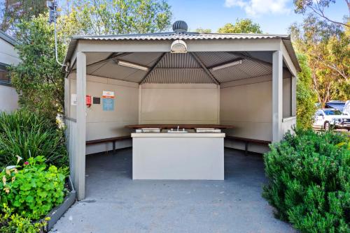 a garage with a white table in it at Discovery Parks - Melbourne in Braybrook