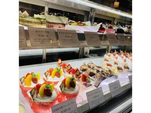 a display case in a bakery with cakes and desserts at Shobara Grand Hotel - Vacation STAY 06883v in Shōbara