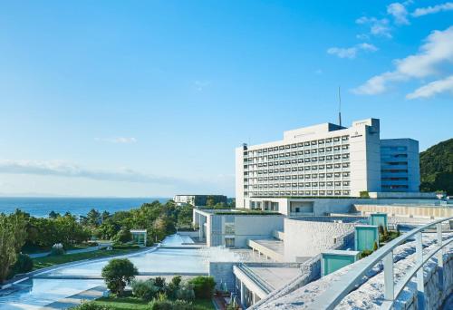 a view of a building and the ocean at GRAND NIKKO AWAJI in Awaji