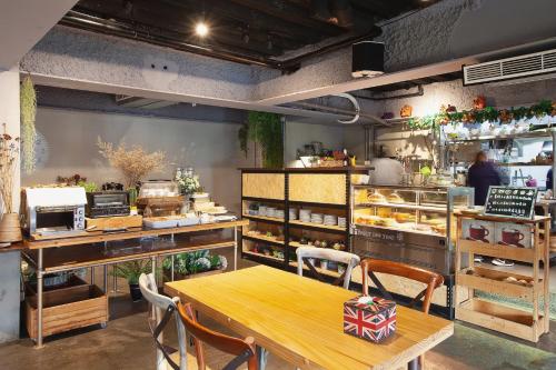 a restaurant with a table and chairs in a room at Tourism Inn in Yongkang