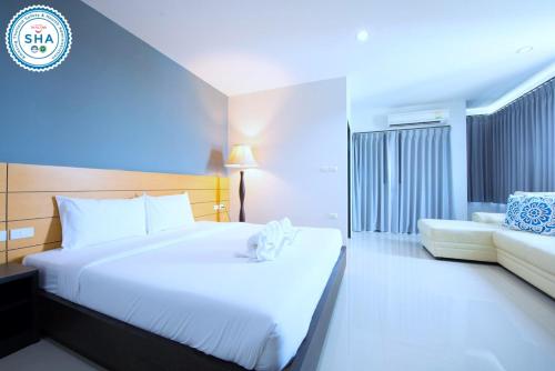 Postel nebo postele na pokoji v ubytování Lee Hotel