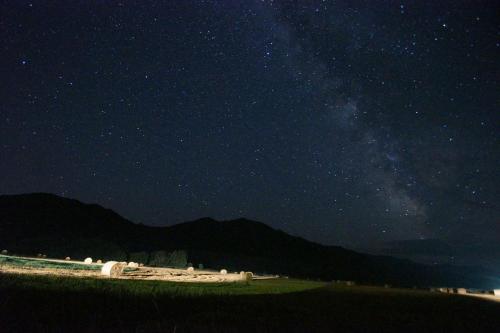 a starry night with the milky way in the sky at Farm Stay Ezura Farm in Engaru