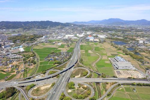 an aerial view of a city with a highway at Sun Hotel Tosu Saga in Tosu