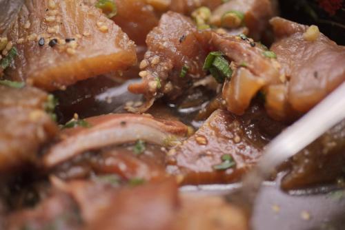 a close up of a plate of food with meat at Business Hotel Kyugetsu in Tsukumi