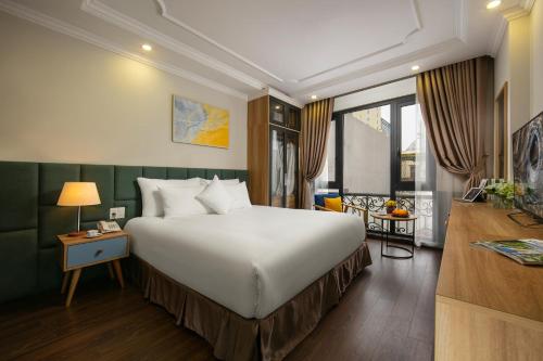 Voodi või voodid majutusasutuse C'Bon Hotel Do Quang toas