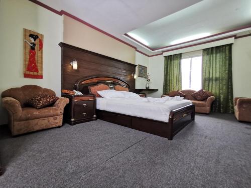 Postel nebo postele na pokoji v ubytování Cebu Hilltop Hotel