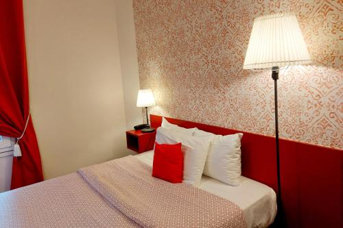Кровать или кровати в номере Hotel Mondial