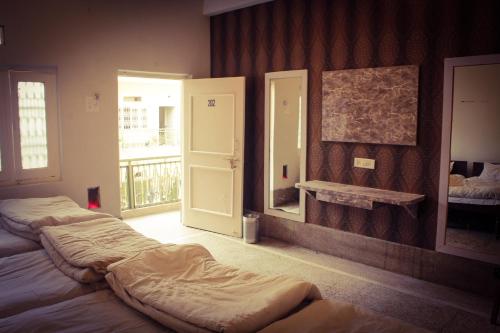 Hotel Anand Palaceにあるベッド