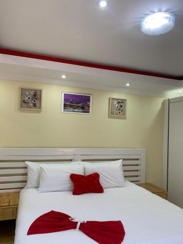 Ένα ή περισσότερα κρεβάτια σε δωμάτιο στο Ekaya Palace Guest House