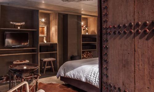Una cama o camas en una habitación de duRuby - Chambre & Suite