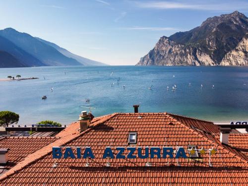 a view of the lake from the roof of a building at Hotel Baia Azzurra - Lake Front in Nago-Torbole