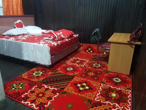 Ліжко або ліжка в номері Mimi Guest House Syariah Pangkalan bun
