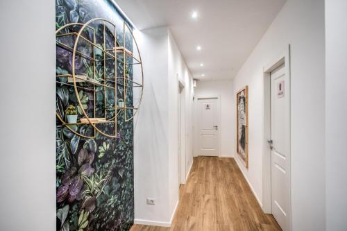 a hallway with a mural on the wall at Oasi Urbana 41 in Rome