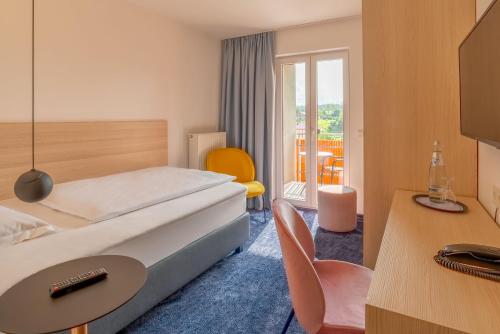 Säng eller sängar i ett rum på Hotel Bei Gretel, Wellness & Ayurveda