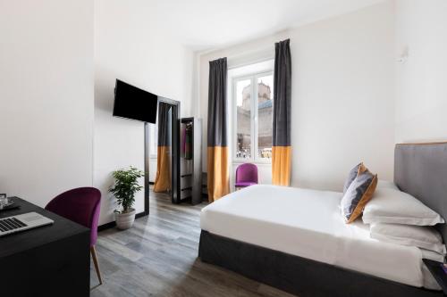 a hotel room with a bed and a desk at Residenza Vaticano in Rome