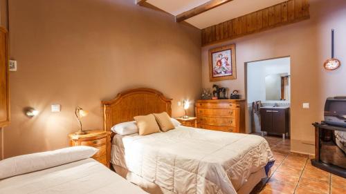 Voodi või voodid majutusasutuse Casa Monte Verde Ojen by Ruralidays toas