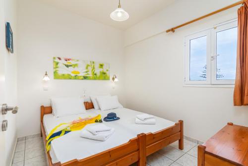 Ένα ή περισσότερα κρεβάτια σε δωμάτιο στο Mylos Apartments Anissaras