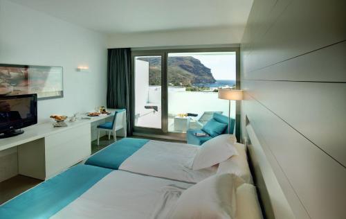 Posteľ alebo postele v izbe v ubytovaní Hotel Spa Calagrande Cabo de Gata