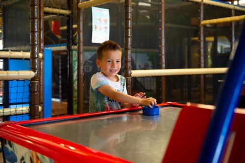 a young boy playing on a trampoline at Camping de Vogel in Hengstdijk