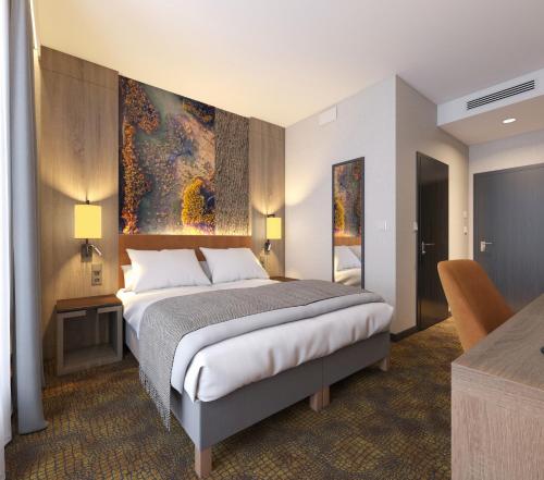 a bedroom with a bed and a painting on the wall at Mercure Bialystok in Białystok