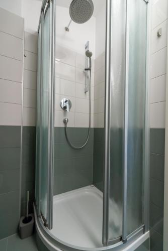 a shower with a glass door in a bathroom at Casa Bamboo in Banjole
