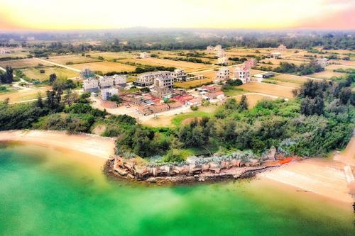 an aerial view of a resort on the beach at 嚨口秘境觀海民宿The heart of the sea in Jinning