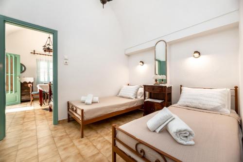 A bed or beds in a room at Authentic Santorinian Home Experience