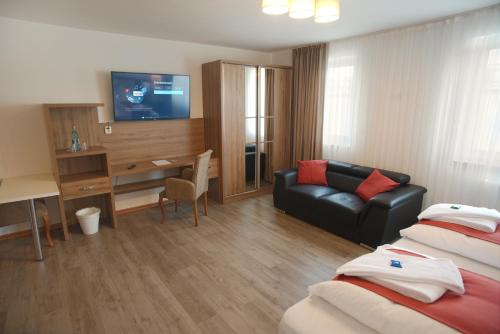 Μια τηλεόραση ή/και κέντρο ψυχαγωγίας στο Hotel Hausen Obertshausen Frankfurt