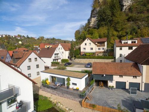 an aerial view of a town with white houses at Bungalow-Ferienhaus Pottenstein in Pottenstein