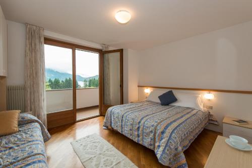 Posteľ alebo postele v izbe v ubytovaní Residence Stefenine
