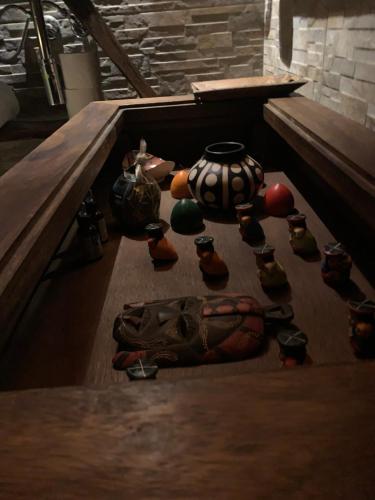 a group of vases on a table in a room at Hotel Motel Residence S in Front