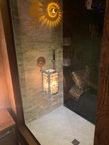 a glass door with a candle in a room at Hotel Motel Residence S in Front