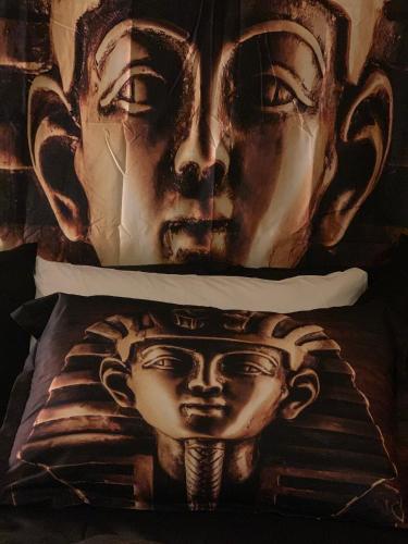 two pillows with a face painted on them at Hotel Motel Residence S in Front
