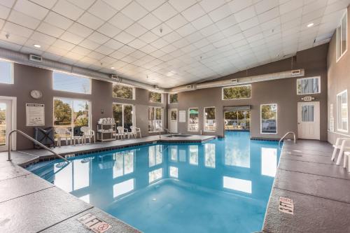 a large pool with blue water in a building at Sleep Inn Little River - North Myrtle Beach in Little River