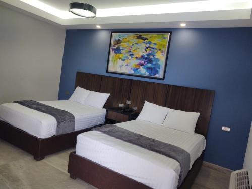 Uma cama ou camas num quarto em SAND MAR HOTEL