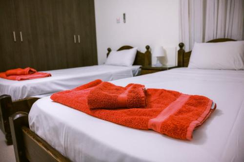 En eller flere senge i et værelse på Villa Costa Cornelia Homes