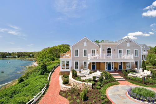 an aerial view of a large house with a view of the water at Wequassett Resort and Golf Club in East Harwich