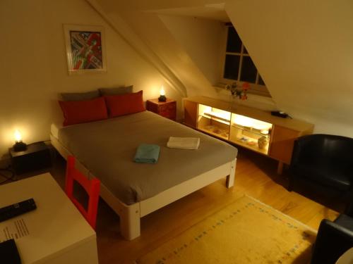 a small bedroom with a bed in a attic at Boutiquehotel Sycamore - Protected City View - 950m from Central Station in Eindhoven