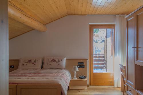Ένα ή περισσότερα κρεβάτια σε δωμάτιο στο Meublè Rosalpina