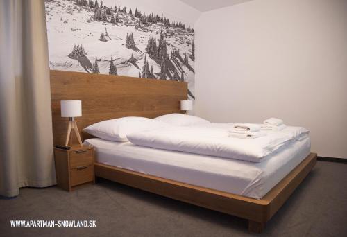 Posteľ alebo postele v izbe v ubytovaní Apartmán u Ričiho-Snowland Valčianska dolina