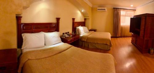 Postel nebo postele na pokoji v ubytování Hotel Ruinas Resort