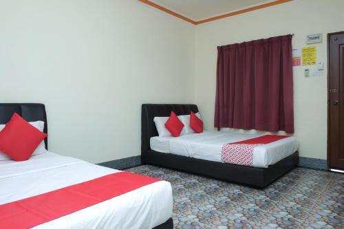 Cama o camas de una habitación en OYO 89928 Acf Guest House