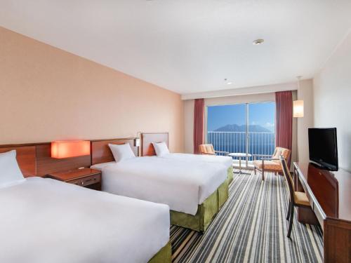 Katil atau katil-katil dalam bilik di Art Hotel Kagoshima