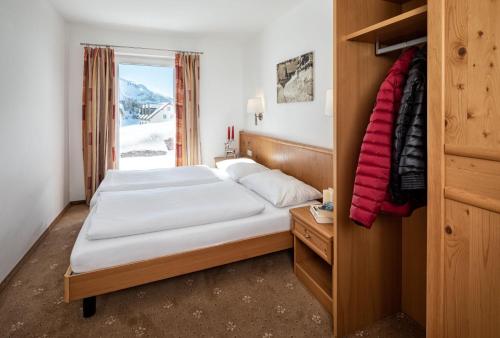 a hotel room with a bed and a window at Fewo-Obertauern-Freja in Obertauern