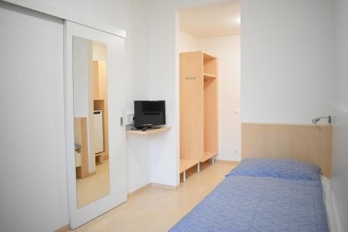 Postel nebo postele na pokoji v ubytování SOVEA Hotel - City